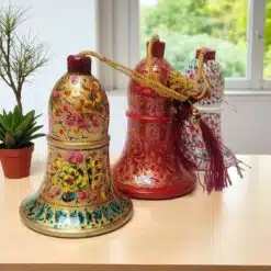 Colorful Hand Painted Bells On Wooden Table