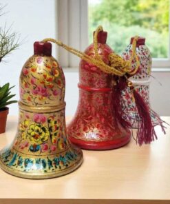 Colorful Hand Painted Bells On Wooden Table