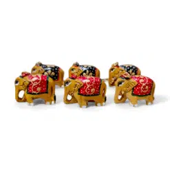 Colorful handcrafted decorative elephant figurines with gold details, symbolizing luck and cultural heritage.
