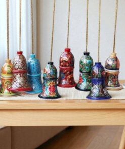 Decorative Paper Mache Bells On Wooden Table