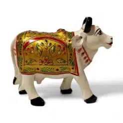 wooden painted cow sculpture