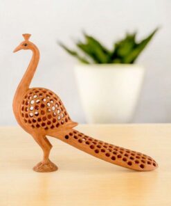 Peacock sculpture with intricate cutouts and graceful design for home decor and art.