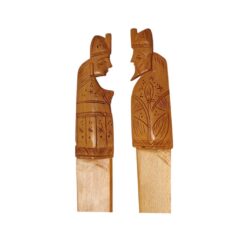 Hand-carved traditional wooden king and queen figures showcasing cultural craftsmanship.