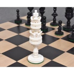Elegant chessboard with ornate white rook and classic black chess pieces for strategic gameplay.