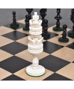 Elegant chessboard with ornate white rook and classic black chess pieces for strategic gameplay.