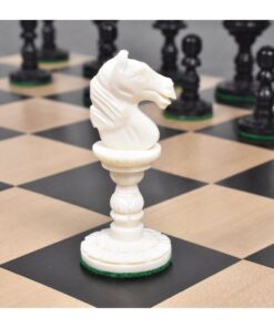 White knight chess piece on wooden and black checkered board with opposing black chess pieces.