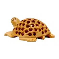 Decorative handcrafted clay turtle figurine with carved perforated shell and natural earthy tones.