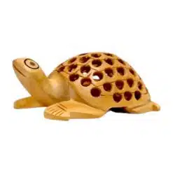Wooden turtle figurine with intricate craftsmanship and decorative shell holes.