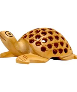 Wooden turtle figurine with intricate craftsmanship and decorative shell holes.