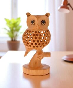 Hand-carved wooden owl figurine with intricate details and expressive eyes for home decor.