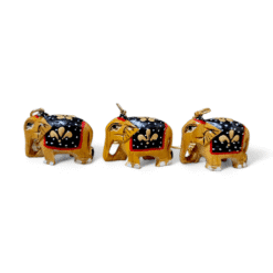 Hand-painted wooden elephant figurines with intricate saddles and cultural significance.