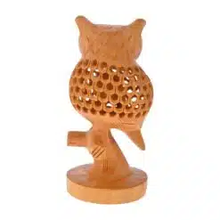 Hand-carved wooden owl sculpture with detailed feathers and natural bark-textured base.