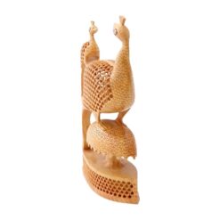 Handcrafted wooden peacock sculpture with intricate feather lattice and elegant organic design.