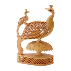 Hand-carved wooden peacock sculpture with intricate lattice work on a natural wood base.
