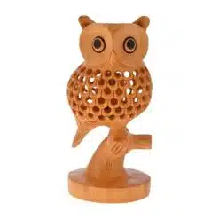 wooden round owl setting on a bunch