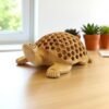 Handcrafted wooden turtle sculpture with carved shell, eco-friendly design, ideal for home decor.