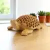 Handcrafted wooden turtle sculpture with carved shell, eco-friendly design, ideal for home decor.