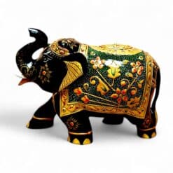 Hand-painted black wooden elephant statue with Indian floral designs and raised trunk.