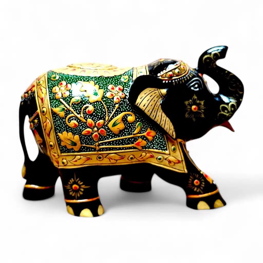 Hand-painted black wooden elephant figurine with gold Indian floral ornamentation and raised trunk.