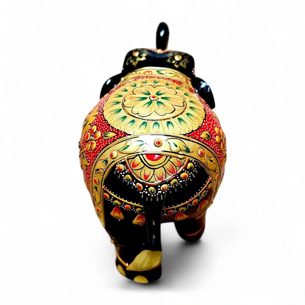 Hand-painted Indian elephant figurine with ornate gold floral ceramic design.