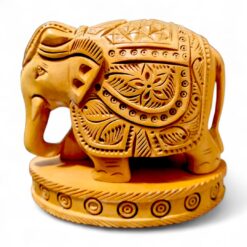 kadam wood elephant figurine on wood base, hand carved deigned on it