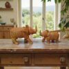 hand-carved wooden rhino statue on a table