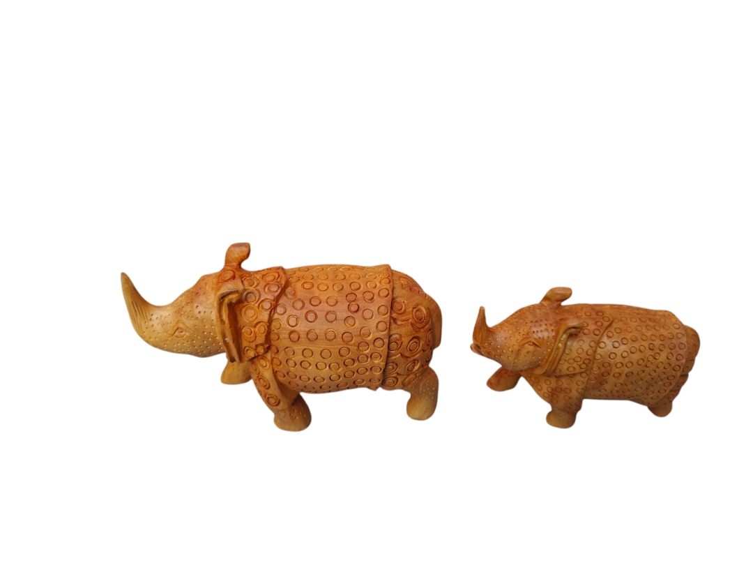 Handcrafted brown rhinoceros figurine pair with carved tribal patterns.