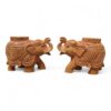 Handcrafted wood elephant planter pair with raised trunks and carved floral patterns.