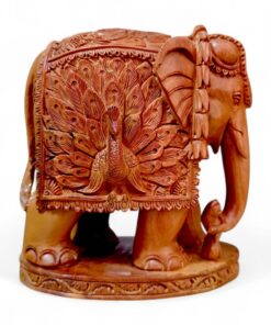 Hand-carved sandalwood elephant figurine with ornate peacock design and decorative base.