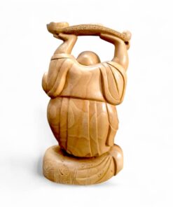 Hand-carved wooden laughing Buddha monk figurine holding ceremonial staff, rear view.