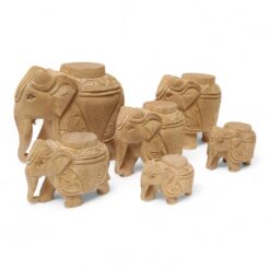 Hand-carved wooden elephant tample piller with Indian carving designs.