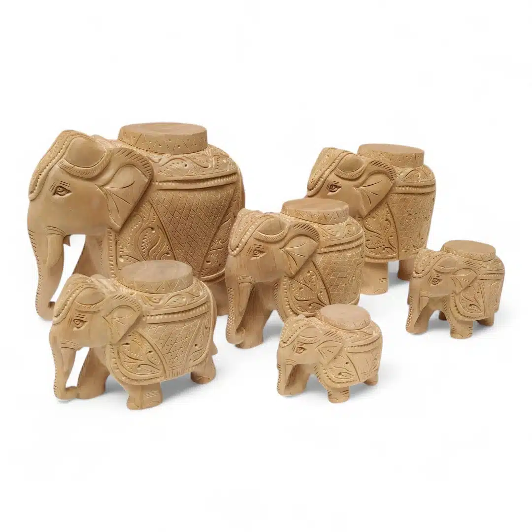 Hand-carved wooden elephant tample piller with Indian carving designs.