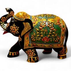 Hand-painted Indian decorative elephant figurine with raised trunk and ornate gold details.