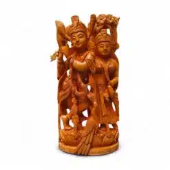 Hand-carved wooden Radha Krishna statue with flute on ornate pedestal.