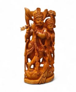 Hand-carved wooden Radha Krishna statue with flute, peacock, and ornate Indian devotional details.