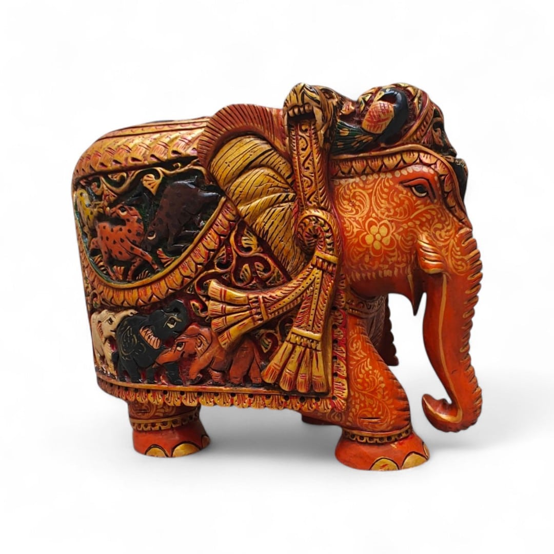Hand-painted Indian decorative elephant figurine with ornate gold floral patterns.