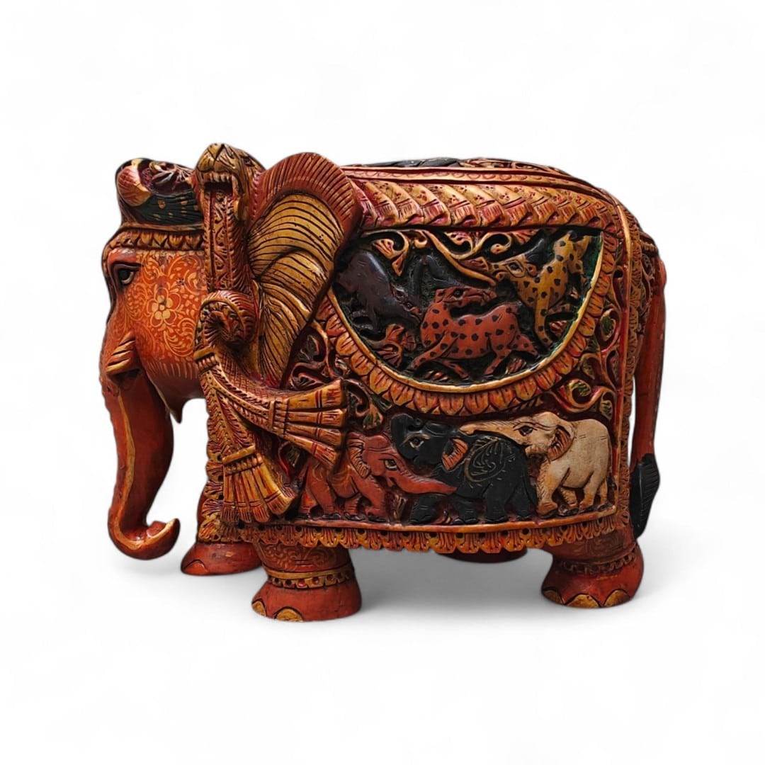 Ornate handcrafted elephant figurine with painted animal scenes and traditional folk art details.