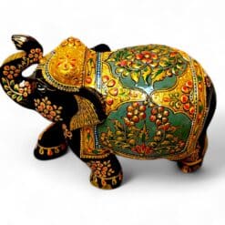 Hand-painted Indian folk art elephant figurine with ornate gold floral details.