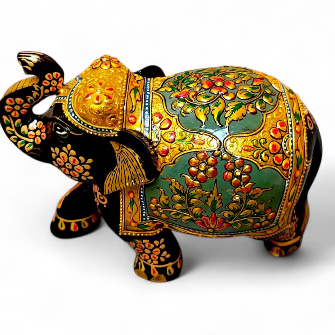 Hand-painted Indian folk art elephant figurine with ornate gold floral details.
