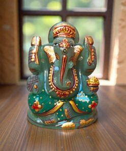 a hand-painted green jade Ganesha statue featuring gold accents