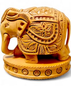 kadam wood elephant figurine on wood base, hand carved deigned on it