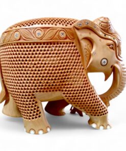 Ornate carved wooden elephant figurine with decorative patterns.