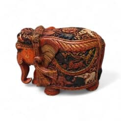 Ornate Indian elephant jewelry box with carved floral patterns and animal motifs.