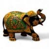 Ornate hand-painted Indian elephant statue with gold, green, and red ceremonial details.