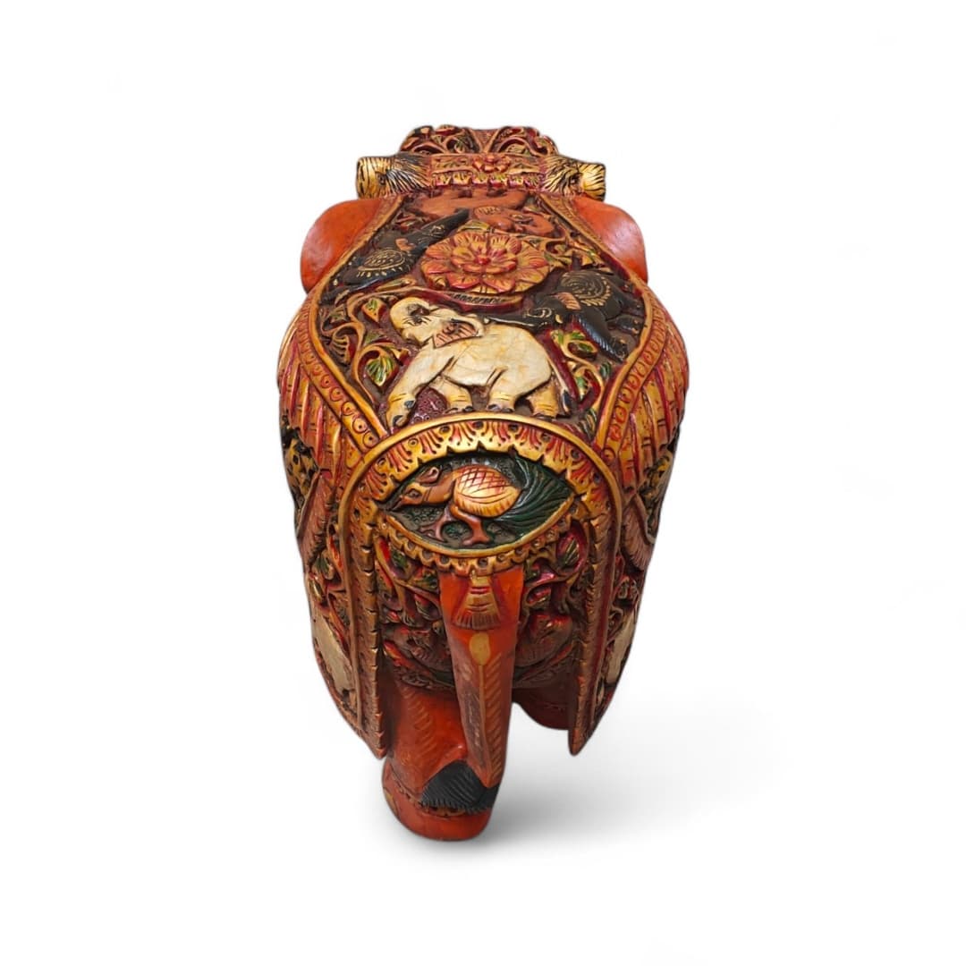 Ornate handcrafted Indian elephant figurine with colorful gold floral patterns.