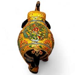 Ornate hand-painted elephant figurine with gold floral patterns and raised trunk.