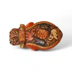 Ornate hand-painted antique vessel with carved mask, floral motifs, and traditional folk art.