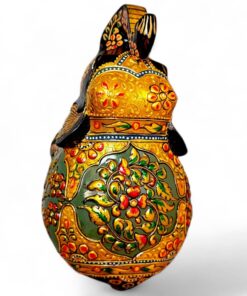 Ornate hand-painted rabbit figurine with glossy gold floral folk art details.