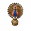 Ornate jeweled peacock figurine with gold fan tail and colorful gemstone pedestal.
