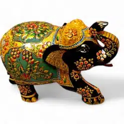 Ornate hand-painted Indian elephant figurine with raised trunk and gold floral decorations.